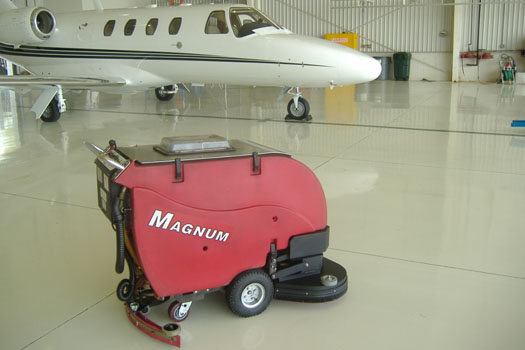Keeping airplane hangers clean is a job for the Magnum floor scrubber, with its cylindrical deck it can scrub and sweep in one pass.