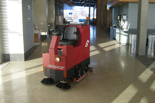 Using one of Factory Cat brand scrubbers or sweepers in a shopping mall gets it clean fast, even early enough for the power walkers in the morning.